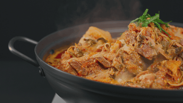 Pork backbone stew boiling in pot