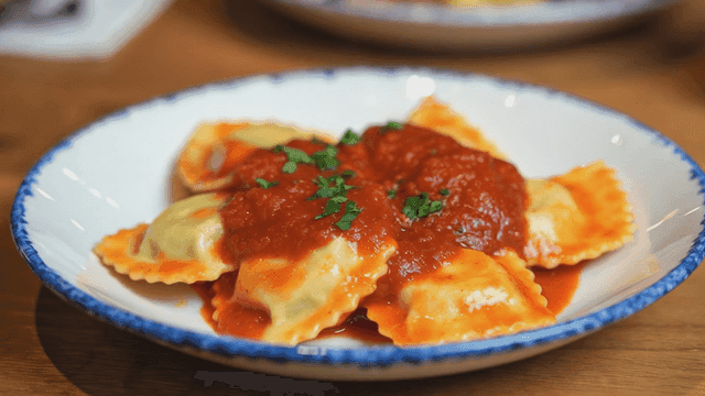 Ravioli with tomato sauce on a plate