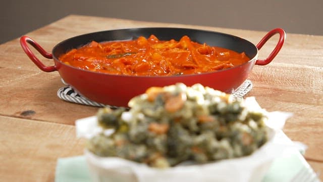 Spicy tteokbokki and crispy fries on wooden table