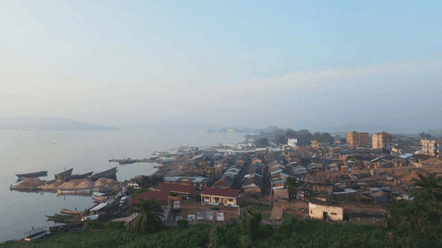 Coastal village with canoes and houses