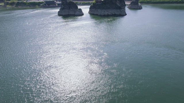 A Serene River Scene with Island Rocks