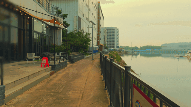 Riverside promenade with modern buildings