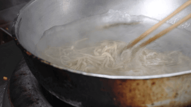 Noodles boiling in a pot