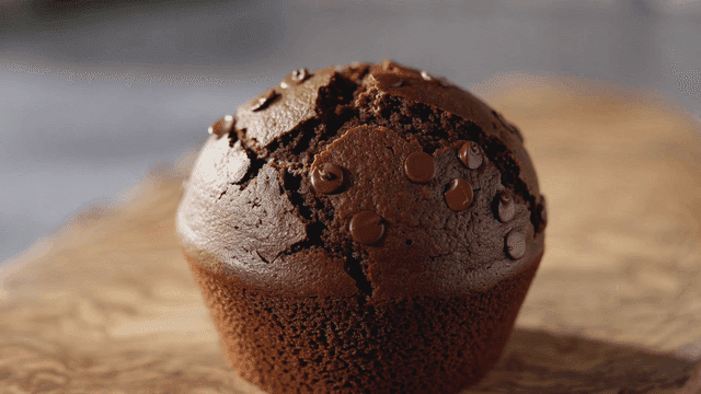 Chocolate muffins on wooden cutting board