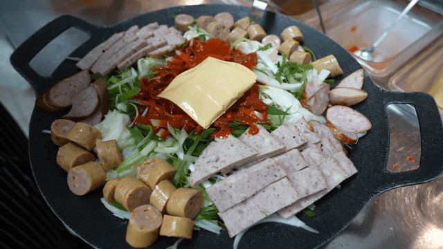 Uncooked budaejjigae with cheese added