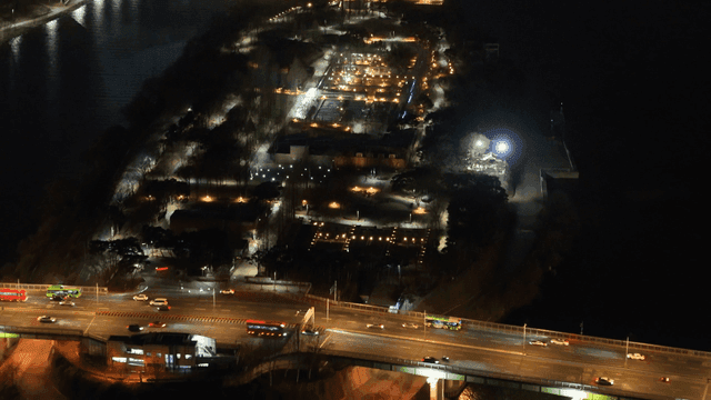 Night view of a city park and bridge