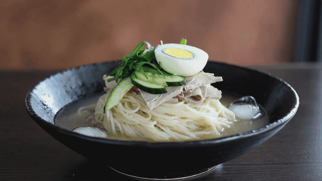 Refreshing bowl of cold noodles with toppings