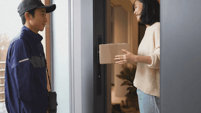 Woman receiving package at door