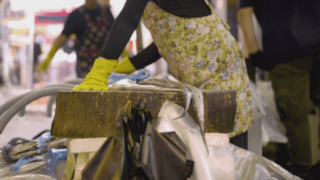 Fish preparation merchant in market