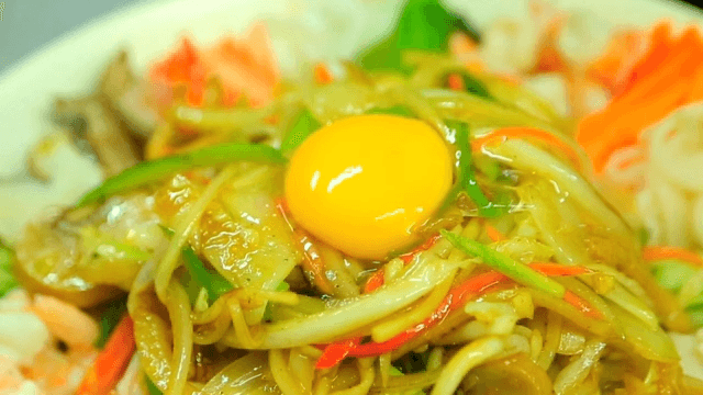 Egg yolk on top of starch sheet salad with mustard sauce