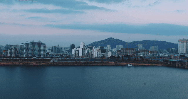 City skyline with mountains in the background