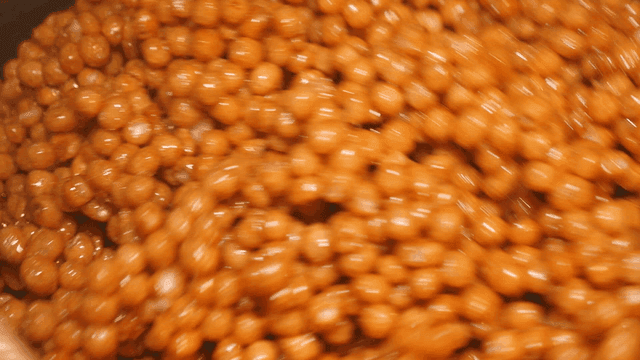 Scene of mixing snacks with honey