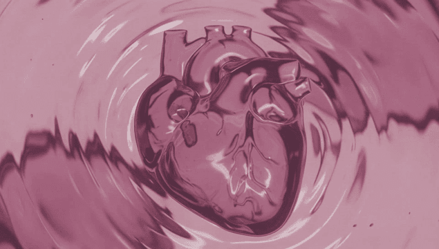 Transparent heart submerged in pink liquid