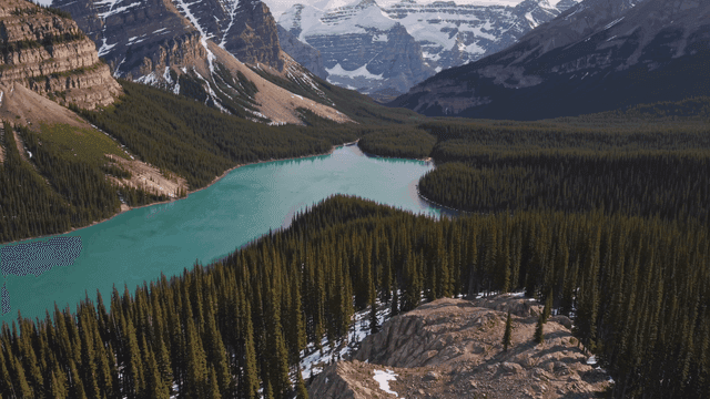 Tranquil lake surrounded by snow-capped mountains