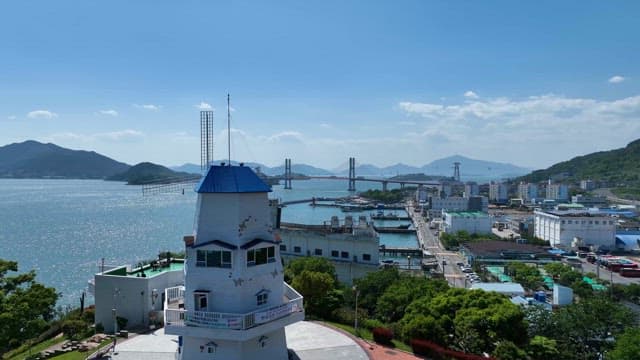 Coastal area with windmills and industrial complexes