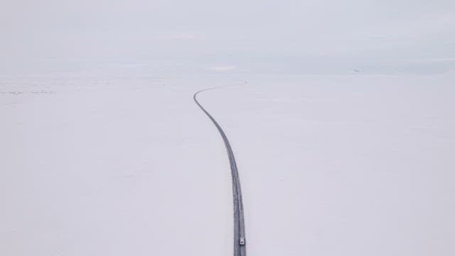 Car driving on a snowy road