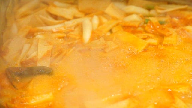 Spicy tteokbokki simmering in a pot