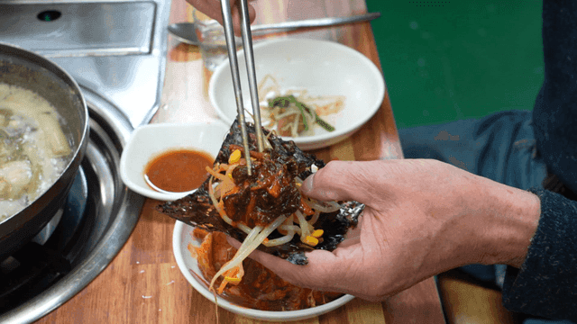 Spicy steamed fish with bean sprouts on seaweed