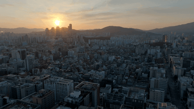 Sunset over a sprawling cityscape
