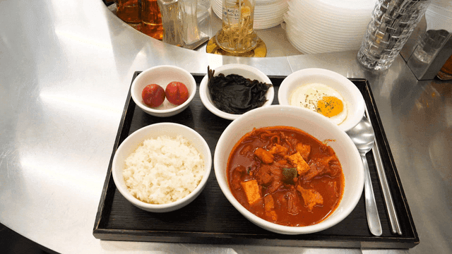 Korean meal with kimchi stew and side dishes