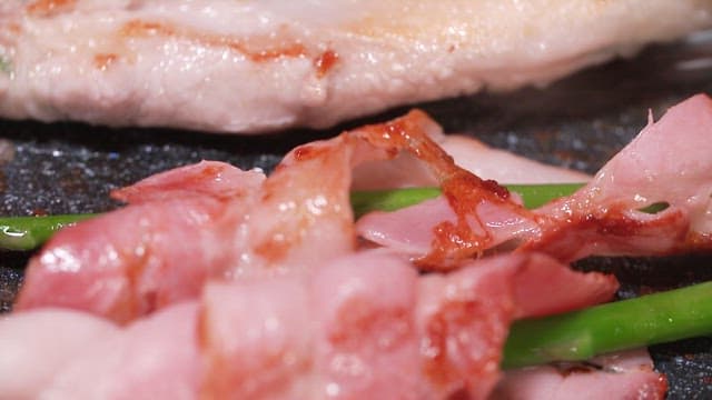 Thin-sliced Pork Belly and Asparagus Grilling on a Hot Pan