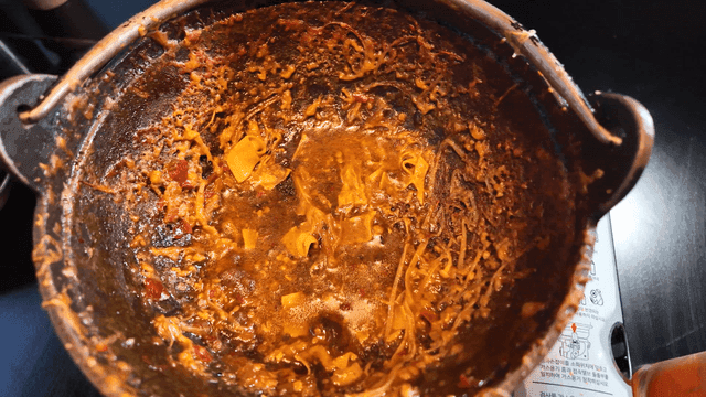 Mala stew and side dishes with empty pot