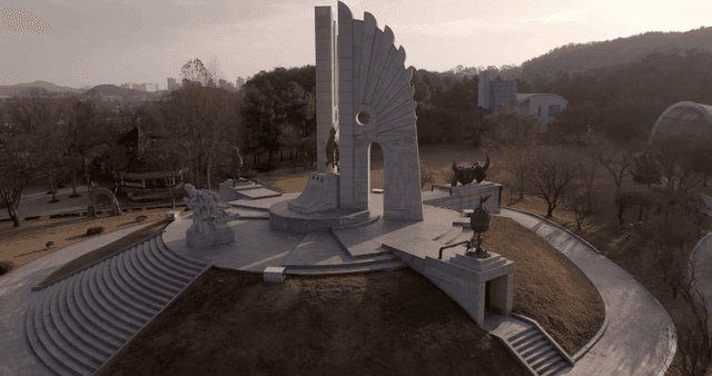 A monument in a serene park setting