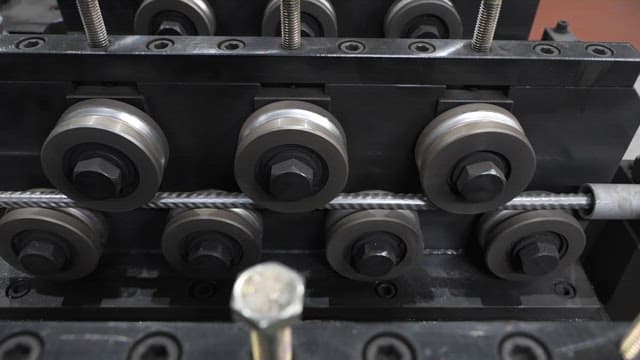 Metal wire being processed in a factory