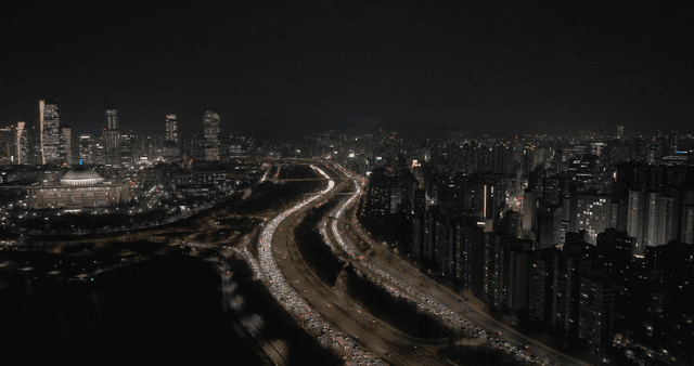 Night view of a bustling city with traffic