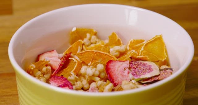 Pouring Milk into Bowl with Fruit and Cereal