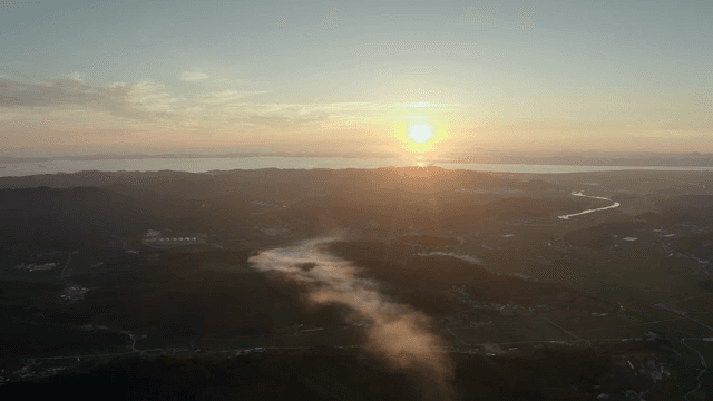Sunset over a vast rural landscape