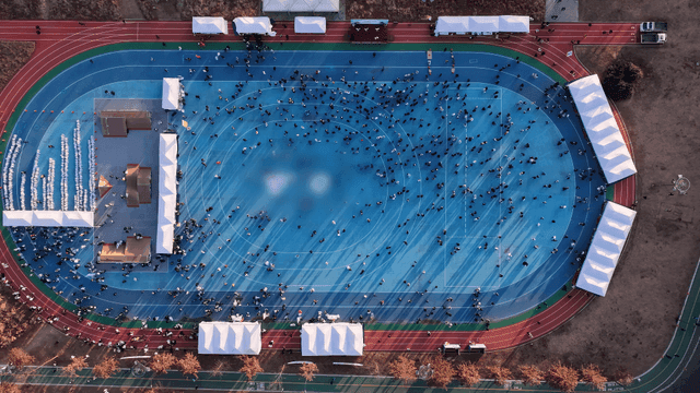 Aerial view of a sports event on a track