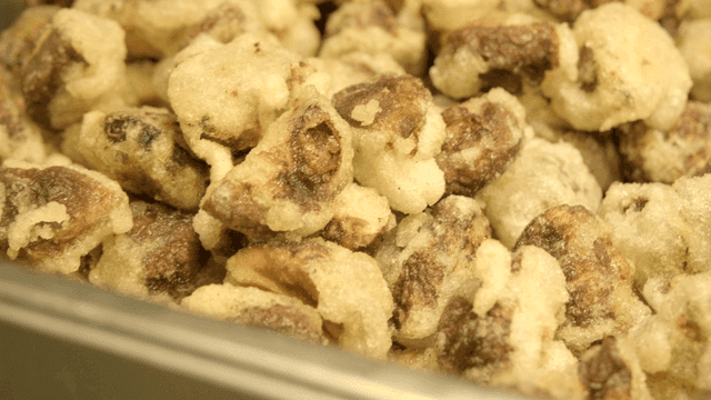 Tray full of sweet and sour pork pieces