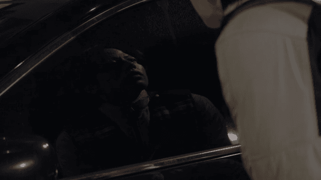 Patrolman checking a parked car