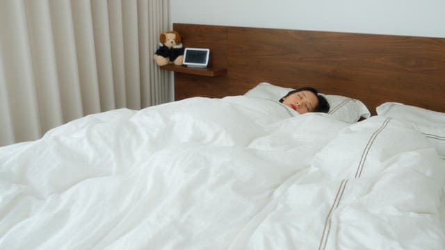 Woman Resting in Bed Throughout the Day