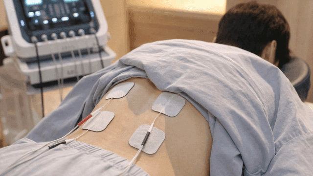 Waist of man receiving electrotherapy