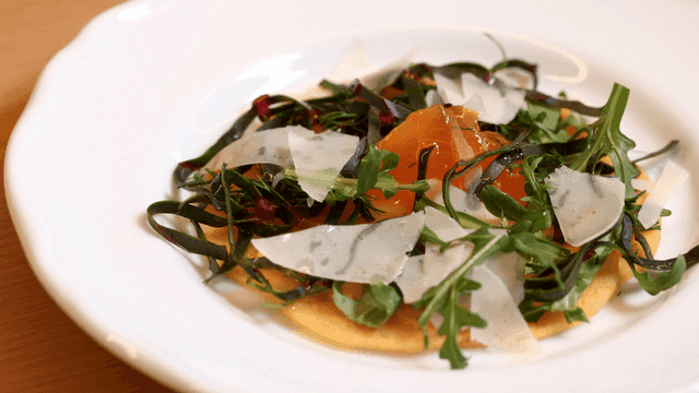 A gourmet salad with fresh greens and cheese