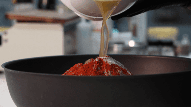Dish where liquid is poured into bowl containing spices