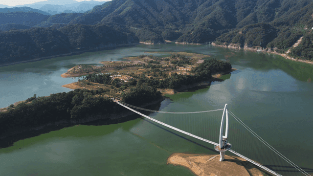 Scenic lake with suspension bridge