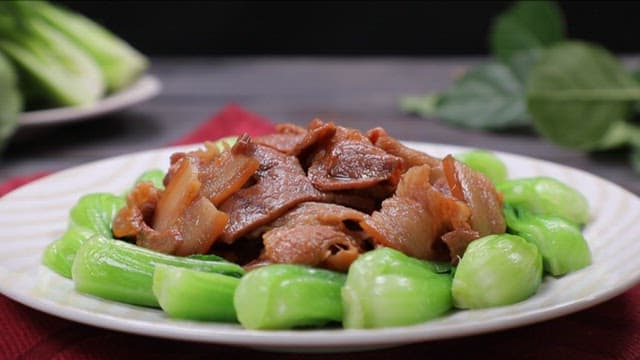 Plate of spice pork with bok choy