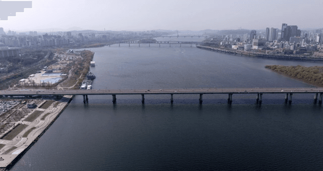Aerial view of a river and city skyline