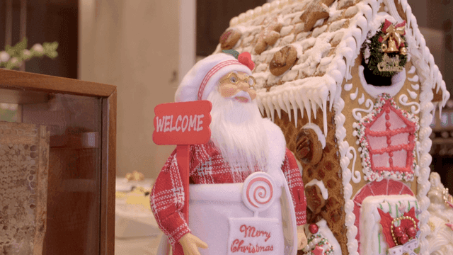 Festive gingerbread house with Santa figure