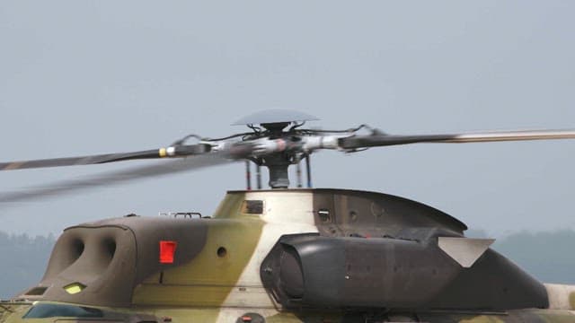 Helicopter blades rotating on a clear day