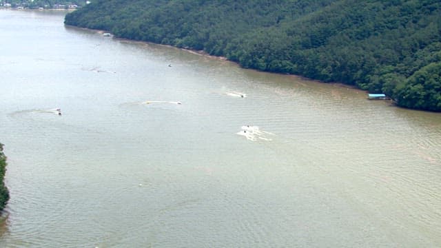 Boats Navigating on a Serene River