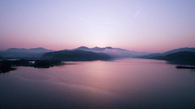 Serene Sunrise Turns a Tranquil Lake Purple