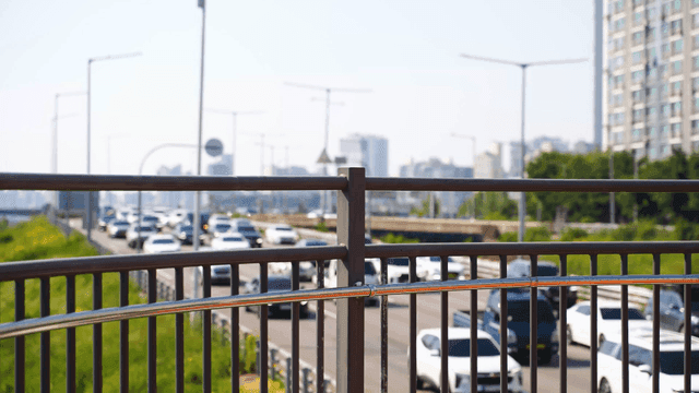 Busy highway with city buildings