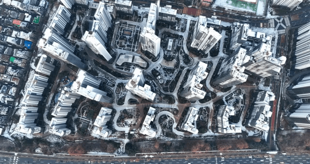 Cityscape with snow-covered high-rise apartments