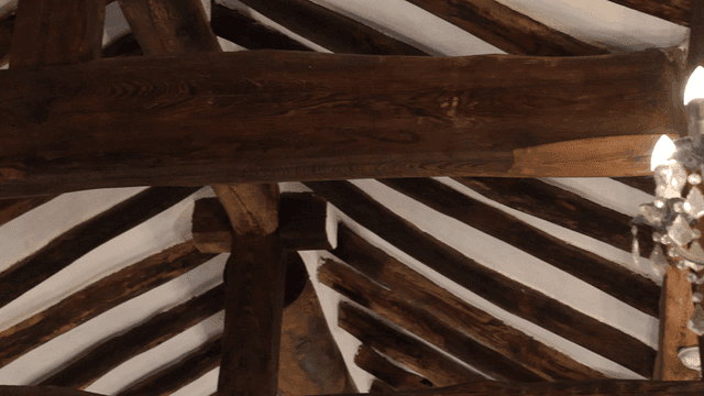 Traditional wooden Hanok ceiling with chandelier