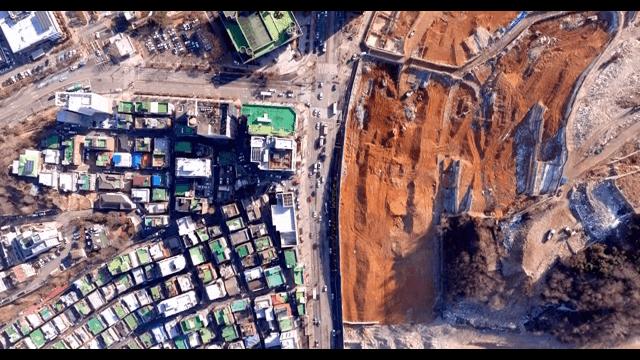 Cityscape with construction site and roads