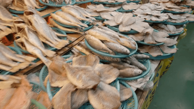 Various dried fish displayed at a market